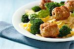 closeup of farfalle pasta with meatballs and broccoli