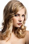 close up beauty portrait of a young and alluring blond girl with hair style over white