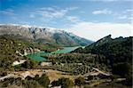 Guadalest valley and its reservoir surrounded by snowcaped mountains