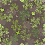 Decorative seamless background with green trefoil pattern.