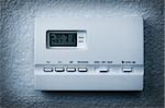 air conditioning control panel on a wall, blue Vignetting