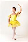 Cute little girl as ballet dancer, studio shot on white background