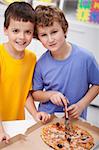 Hungry boys with pizza in their room