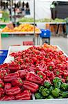 Red and green peppers on display at a street market stall