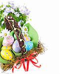 easter egg in basket with spring flower isolated on white background