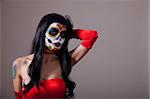 Sugar skull girl in red dress, copy-space for your text