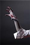 Creepy zombie hand, extreme body-art, studio shot