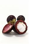 fresh cut mangosteen on a light background