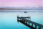 An image of a wooden jetty at the lake Starnberg in Bavaria Germany