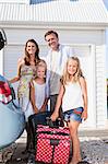 Family loading up car trunk