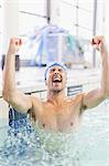 Swimmer cheering in pool