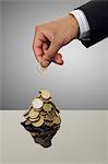 Businessman stacking Euro coins