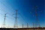 Power lines against blue sky