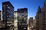 Buildings lit up at dusk in downtown Manhattan looking north, New York City, New York State, USA