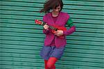 Young woman playing ukulele