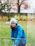 Girl cleaning window