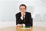 Portrait of businessman sitting at desk