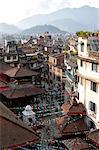 View over narrow streets and rooftops near Durbar Square towards the hilltop temple of Swayambhunath, Kathmandu, Nepal, Asia