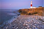 The moon glows over the sea at Portland Bill, Jurassic Coast, UNESCO World Heritage Site, Dorset, England, United Kingdom, Europe