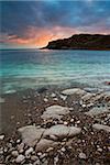 Sunset over the circular bay at Lulworth Cove, Jurassic Coast, UNESCO World Heritage Site, Dorset, England, United Kingdom, Europe