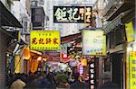 Crowds walking along food street of Rua da Cunha,Taipa, Macau, China, Asia