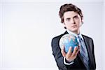 Portrait of Young Businessman holding World Globe