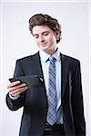 Young Businessman Looking at Digital Tablet