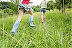 Two Girls Running in Field