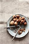 Walnuts and Hazelnuts in Bowl with Nutcracker