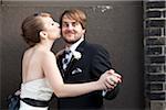 Bride Kissing Groom on Cheek