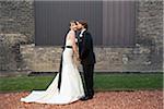 Groom Kissing Bride on Cheek