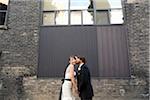 Groom Kissing Bride on Cheek