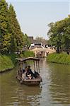 Tourist boat on canal at old town of Wuzhen, Zhejiang, China