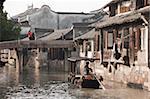 Tourist boat on canal at old town of Wuzhen, Zhejiang, China