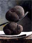 Black truffles with fork