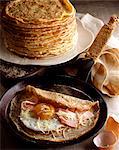 Egg and ham crepe in pan