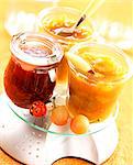 Pots of plum and raspberry jams