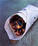 Grilled chestnuts in paper cone