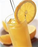 Glass of orange juice with orange slice