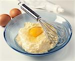 Preparing pastry with eggs and whisk