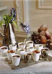 Teatime buffet with Madeleine sponge cakes and chocolate cups