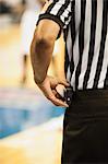 Basketball referee, cropped rear view
