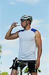 Cyclist drink bottle water, portrait