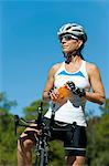 Female cyclist taking break