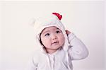 Baby girl wearing bear hat, portrait