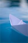 Paper boat floating on water