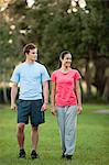 Young couple walking in park