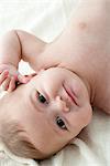 Baby boy lying on back, portrait