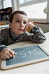 Boy solving math problem