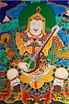 A wall painting of Yulkhorseng, God of the East, with his lute, at the 17th century Paro Dzong.